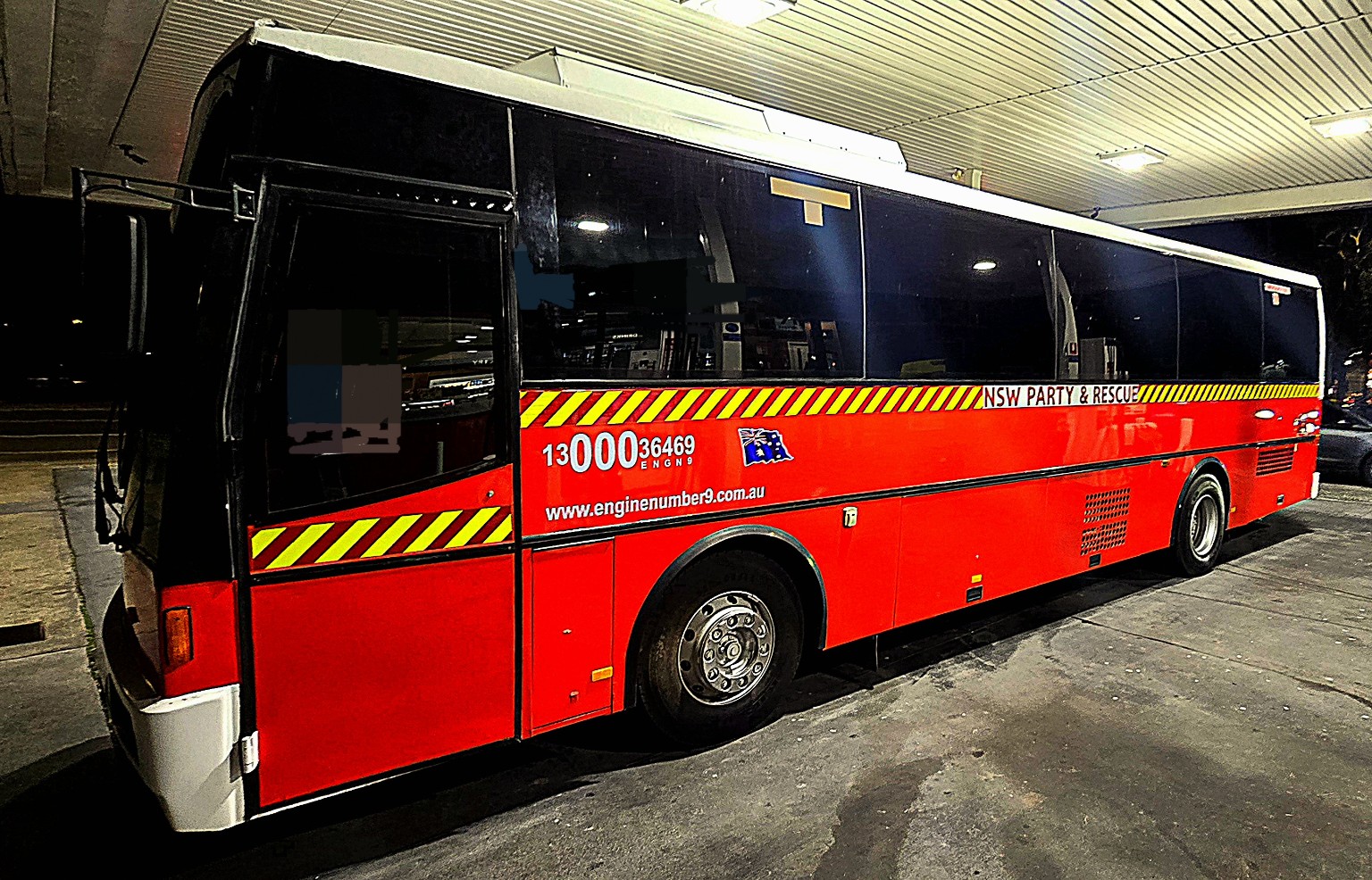 NSW Party and Rescue Fire Bus exterior at night in Sydney